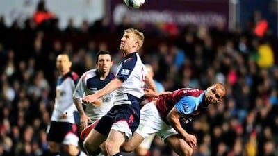 Bolton Wanderers’ Tim Ream, centre, vies with Aston Villa’s Gabriel Agbonlahor. Glyn Kirk / AFP