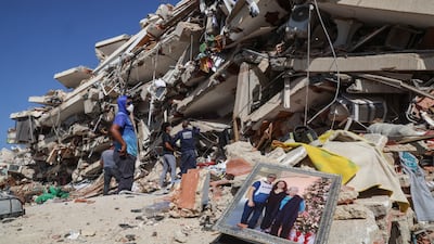 Emergency responders search for bodies in the debris of a building in Caraballeda city after two earthquakes struck Venezuela and other parts the Caribbean. Getty Images