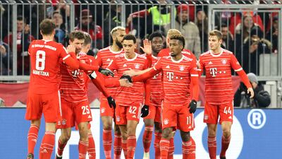 Bayern Munich players celebrate after Bayern's Kingsley Coman, second right, scored his side's second goal during the Bundesliga soccer match between Bayern Munich and Union Berlin at the Allianz Arena in Munich, Germany, Sunday, Feb. 26, 2023. (AP Photo / Alexandra Beier )