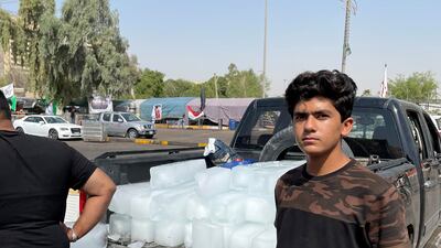 Volunteers unload ice blocks from a pick-up truck for the protesters.