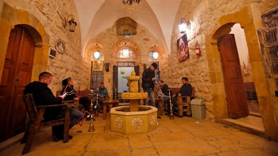Men smoke waterpipes (shisha or hookah) as they sit at the premises of the first traditional Turkish bath (Hammam) opening in the occupied Palestinian West Bank city of Hebron. Aziz Hijazi, the venue's 35-year-old Palestinian founder, returned from Turkey to open a traditional men-only bathhouse in Hebron's old city with the aim of bringing in tourists and providing relaxation for its Palestinian residents. AFP