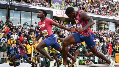 Fred Kerley crosses the finish line ahead of Trayvon Bromell and Marvin Bracy to win the men's 100m final. AFP