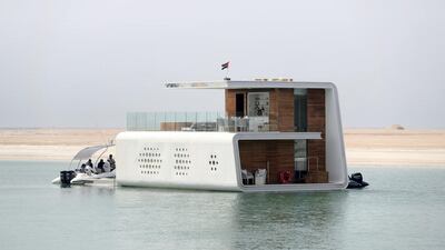 Police say they will transform one of the 'floating seahorse' villas, which contain rooms below the water, into an unmanned police station. Chris Whiteoak / The National