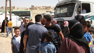Displaced Syrians hug each others upon their return from Lebanon, through Al Zamrani corridor to their homes in Al Qalamoun area in Damascus countryside, Syria, 23 July 2018. EPA