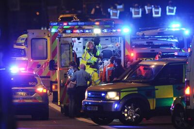Members of the emergency services attend to victims of the terror attack on London Bridge AFP