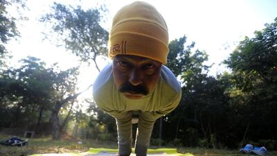 An Indian man practices Yoga at a park in the morning in Bhopal, India. Yoga is more than just stretches, and keeps the mind calm and a peaceful state of mind. Sanjeev Gupta / EPA