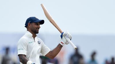 Shikhar Dhawan was bound for Melbourne to spend time with his family, but instead finds himself in the thick of action in his India whites. Ishara Kodikara / AFP