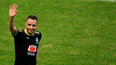 Brazil’s Renato Augusto waves as he attends training. Ricardo Moraes / Reuters