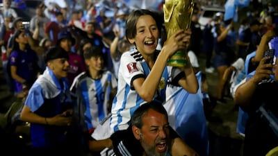 Fans gather outside of the Association of Argentinian Football Headquarters ahead of the team arrival. Reuters