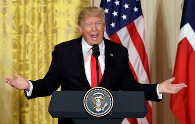 President Donald Trump speaks during a news conference in the East Room of the White House in Washington. AP