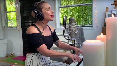 Golden weights by Versace can be seen behind Lady Gaga as she performs 'Smile'. YouTube