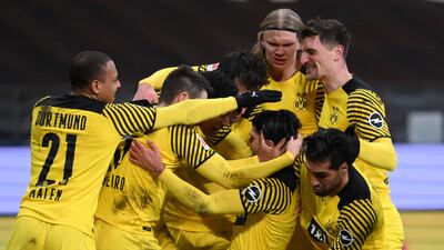 Dortmund's Mahmoud Dahoud celebrates with teammates after scoring the late winner at Eintracht Frankfurt. Getty