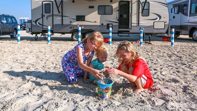 A two-room caravan on a Dubai beach, from Prestige Motorhome Rentals, is great for the family. Victor Besa for The National