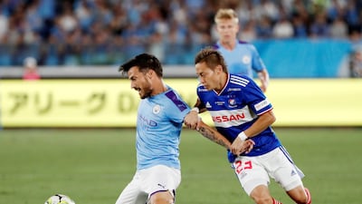 Manchester City's David Silva in action with Yokohama F Marinos' Teruhito Nakagawa. The English champions ran out 3-1 winners on Saturday. Reuters