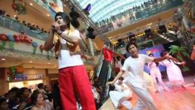 Spectators enjoy traditional music and dance routines celebrating Philippine Independence Day at Khalidiyah Mall in Abu Dhabi.
