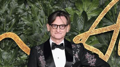 Hamish Bowles of American Vogue puts on a brocade tuxedo. Getty