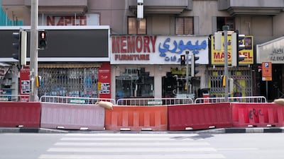 Barriers set outside Naif. Once vibrant, Deira's streets are now more quiet after the movement restrictions were enforced by Dubai Police. Reem Mohammed / The National