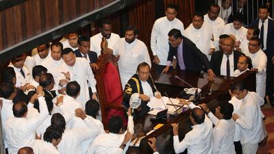 Sri Lankan MPs argue in front of the speaker, Karu Jayasuriya, on November 15, 2018. Reuters