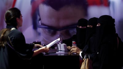 Saudi job seekers talk to a company representative at Glowork Women's Career Fair in Riyadh, Saudi Arabia. Reuters