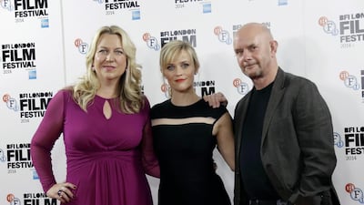 Author Cheryl Strayed, actress Reese Witherspoon, and screenwriter Nick Hornby at a photo call for the film Wild, during the BFI London Film Festival in London, Monday, October 13, 2014. AP