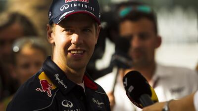 Why shouldn't Sebastian Vettel smile. He and Red Bull Racing have now won four consecutive driver and manufacturer titles. Christopher Pike / The National