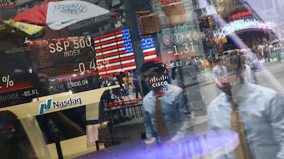 New Yorkers are reflected in the window of the Nasdaq MarketSite in Times Square. Facebook took a 20 per cent hit in one day last last month, the worst ever loss for a single stock in the history of the US stock market. Photo: AFP