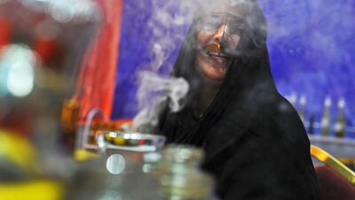 An Emirati woman selling oud waits for shoppers to arrive at the popular Ramadan and Eid Festival at Adnec, which finishes on Saturday. Delores Johnson / The National