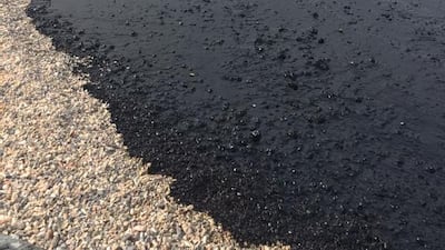 Crude washes up at Kalba after Sunday’s oil spill. Finding those responsible can be a huge task. Courtesy Binzayed Al Zaabi