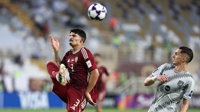 Lucas Pimenta of Al Wahda, left, battles with Adil Boulbina of Al Duhail during the AFC Champions League Elite game at Al Nahyan Stadium, Abu Dhabi. All photos: Chris Whiteoak / The National