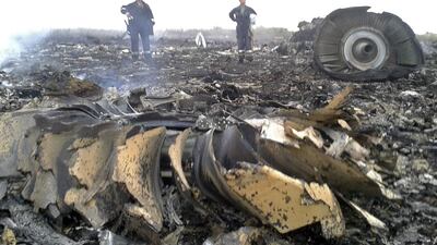 Emergencies workers at the site of a Malaysia Airlines Boeing 777 plane crash in the settlement of Grabovo in the Donetsk region on July 17, 2014. Maxim Zmeyev/Reuters