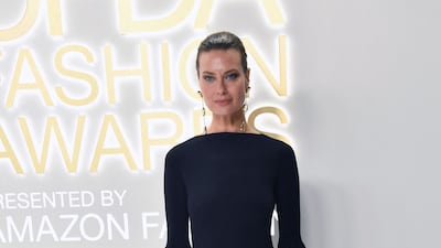 Canadian model Shalom Harlow arrives at the event in frilled monochrome dress.