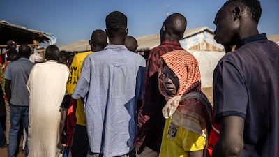 People who fled the war in Sudan wait to be registered at the Joda Border Crossing Point. More than 200 people share one toilet at the transit centre in Renk and cases of cholera and measles are on the rise