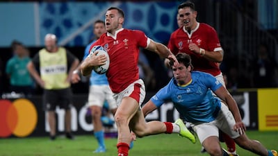 Wales' scrum-half Gareth Davies scores a try during the 2019 Rugby World Cup Pool D match against Uruguay at the Kumamoto Stadium. AFP