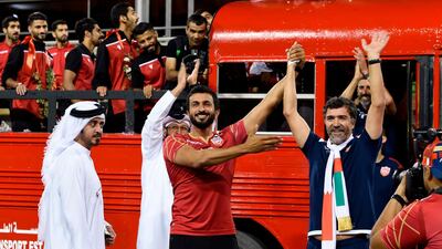 Bahrain's players and coach Helio Sousa (R) arrive to the celebrations at Bahrain International Circuit in Sakhir. AFP