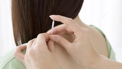 “Text neck” is caused by technology-related, chronically poor posture that creates muscular changes in the body. iStock