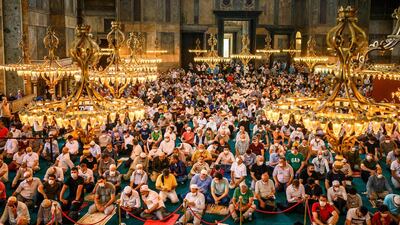 Worshippers pray in Hagia Sophia, in Istanbul, during the first Muslim prayers since the controversial reconversion of the iconic Istanbul cathedral into a mosque. AFP