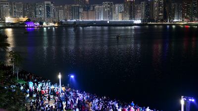 Spectators prepare to watch the fireworks display for UAE's 51st National Day on Al Maryah Island, Abu Dhabi. Khushnum Bhandari / The National