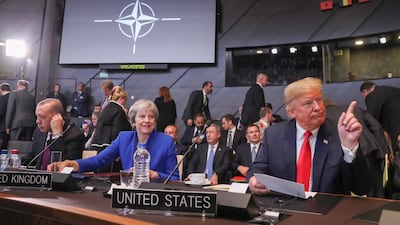 (L-R) Turkish President Recep Tayyip Erdogan, British Prime Minister Theresa May, and US President Donald J. Trump before the start of the North Atlantic Council round table during a NATO summit in Brussels, Belgium, 11 July 2018. NATO countries' heads of states and governments gather in Brussels for a two-day meeting. EPA/
