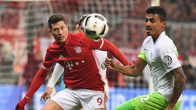 Robert Lewandowski, left, of Bayern Munich in action against Luiz Gustavo of Wolfsburg in Munich on February 7, 2017. Lukas Barth / EPA