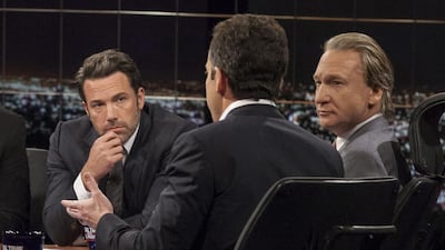 Host Bill Maher, right, and actor Ben Affleck, left, look on as Sam Harris, author of Waking Up: A Guide to Spirituality Without Religion, speaks during Real Time With Bill Maher, in Los Angeles. HBO / AP photo