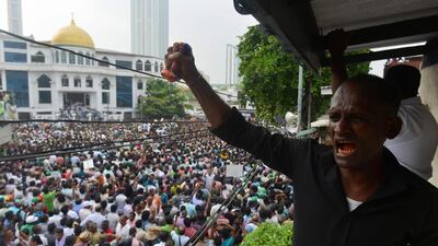 Supporters of Ranil Wickremesinghe protest against the Sri Lankan prime minister's removal near his official residence in Colombo. AFP