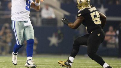 Dallas Cowboys quarterback Tony Romo passes the ball against the New Orleans Saints in the first half of their victory on Sunday in the NFL. Larry W Smith / EPA / September 28, 2014