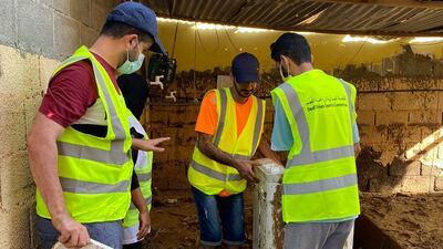 Members of Oman’s deaf community help to clean up after Cyclone Shaheen in Khaburah. Photo: Azza Al Mabsali