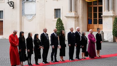 Royal household staff and Foreign Secretary Yvette Cooper, right, await the arrival of the royal couple. PA