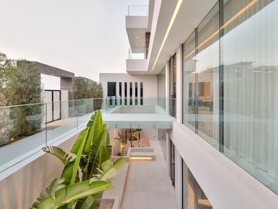 The floating bridge over the bottom-floor courtyard. Courtesy Luxhabitat Sotheby's International Realty