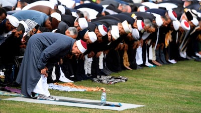 People pray during congregational Friday prayers and two minutes of silence for victims at Hagley Park. AFP