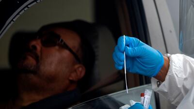 A health worker administers a Covid-19 test at United Memorial Medical Center testing site in Houston, Texas, on June 25, 2020. AFP