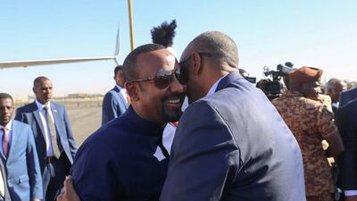 Ethiopian Prime Minister Abiy Ahmed is greeted by Sudan's military leader Gen Abdel Fattah Al Burhan in Sudan. Photo: Suna Agency / Twitter