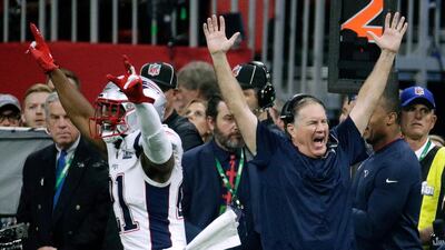 New England Patriots' head coach Bill Belichick, right, celebrates his side's historic triumph. AP Photo