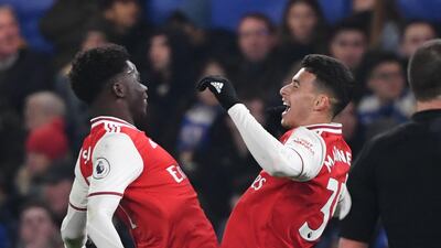 Arsenal's Brazilian striker Gabriel Martinelli (R) celebrates with Bukayo Saka after scoring the first equaliser. AFP
